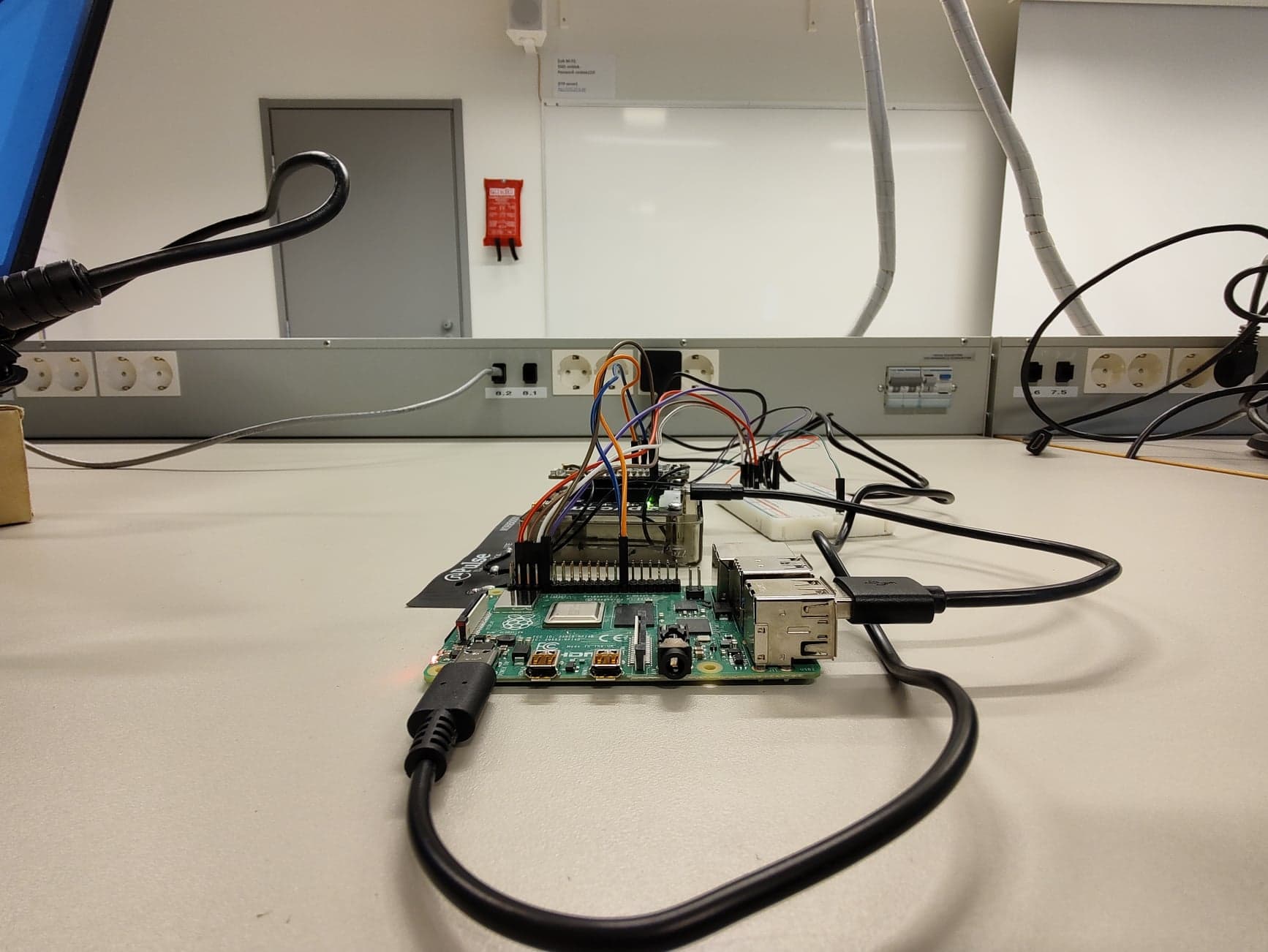 Weatherproof field IoT enclosure housing Linux gateway, power regulation, and cellular antenna.