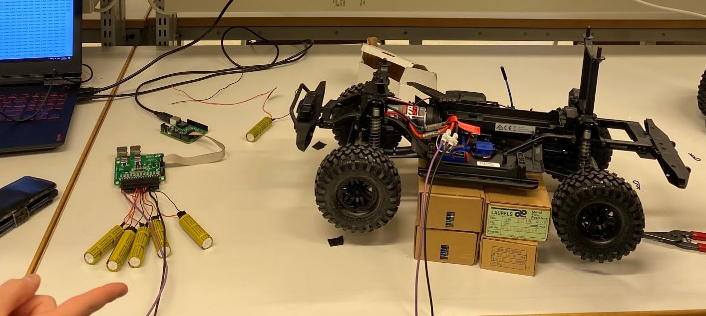 Physical BMS testbench hardware setup with 4WD RC vehicle chassis, 2P4S LTO battery stack, Analog Devices LTC6811 multicell monitor, and Linduino microcontroller.